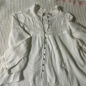 POL oversized small white gauze high low shirt with lace and silver buttons.